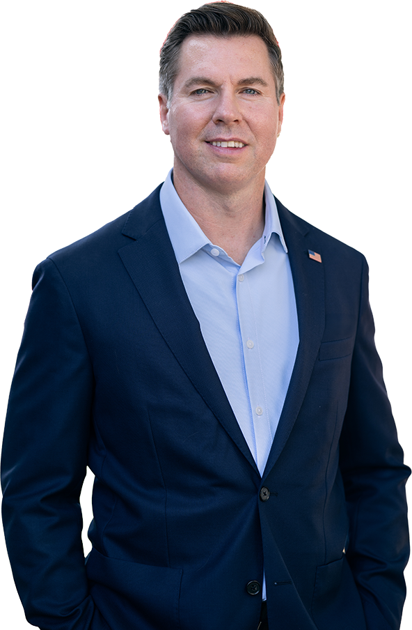 Republican Adam Pugh standing proudly in front of the American flag